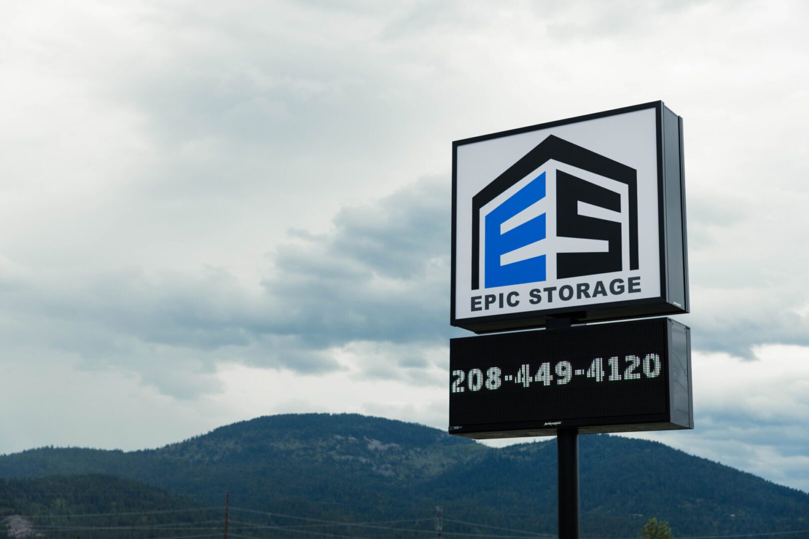 ra-1 Storage company sign with mountain backdrop.