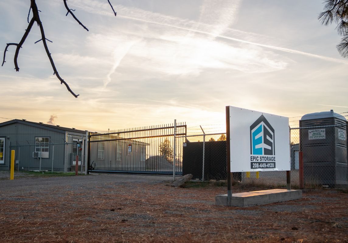 3-1 Storage facility entrance with sign and gate.