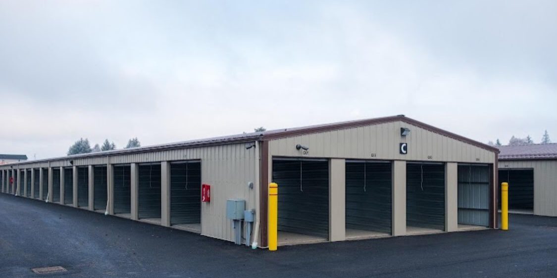 Seltice-3 Storage units with open doors, overcast sky.