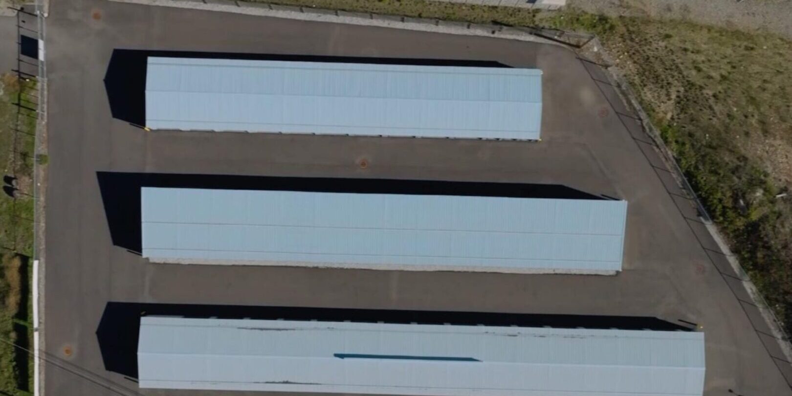 downtown-2 Aerial view of three long, rectangular buildings.