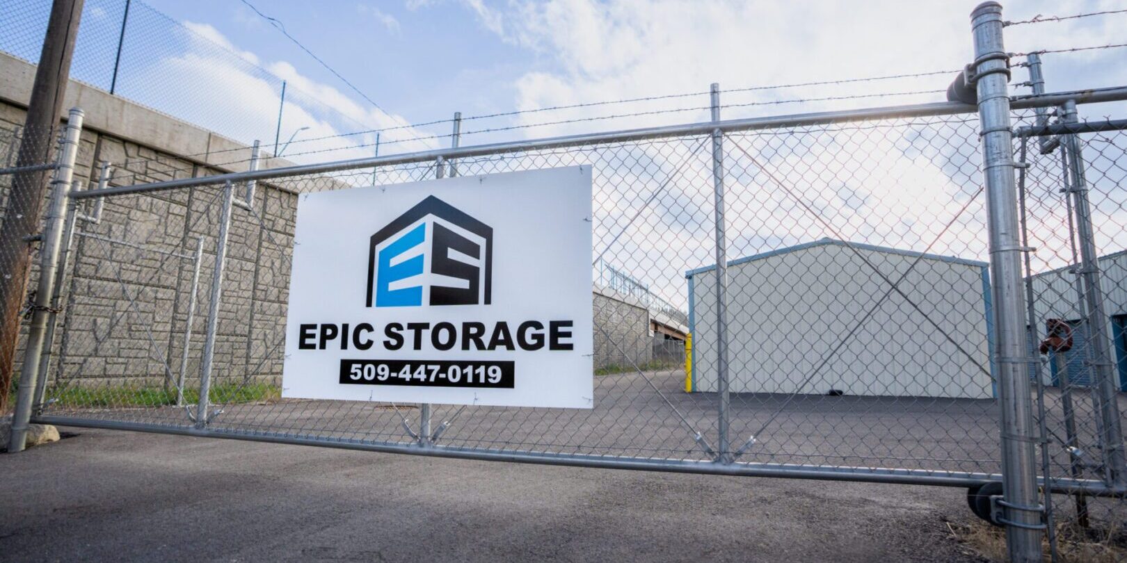 downtown-3 Storage facility gate with signage and contact.