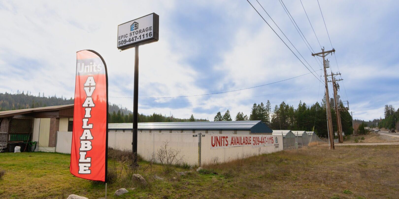 hwy-2 Storage units available sign and building exterior.